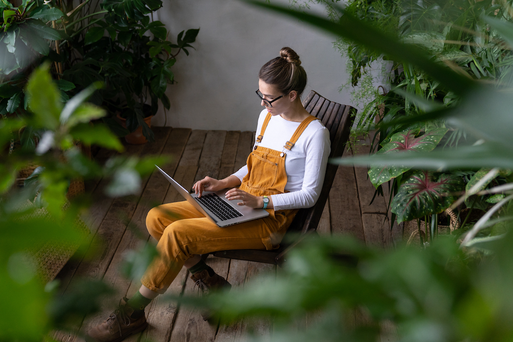 A young woman works on her computer