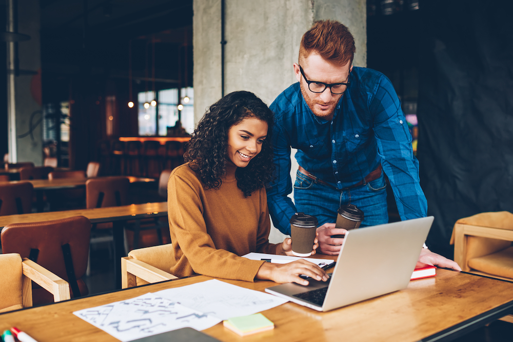 Two business people looking up search engine optimization services