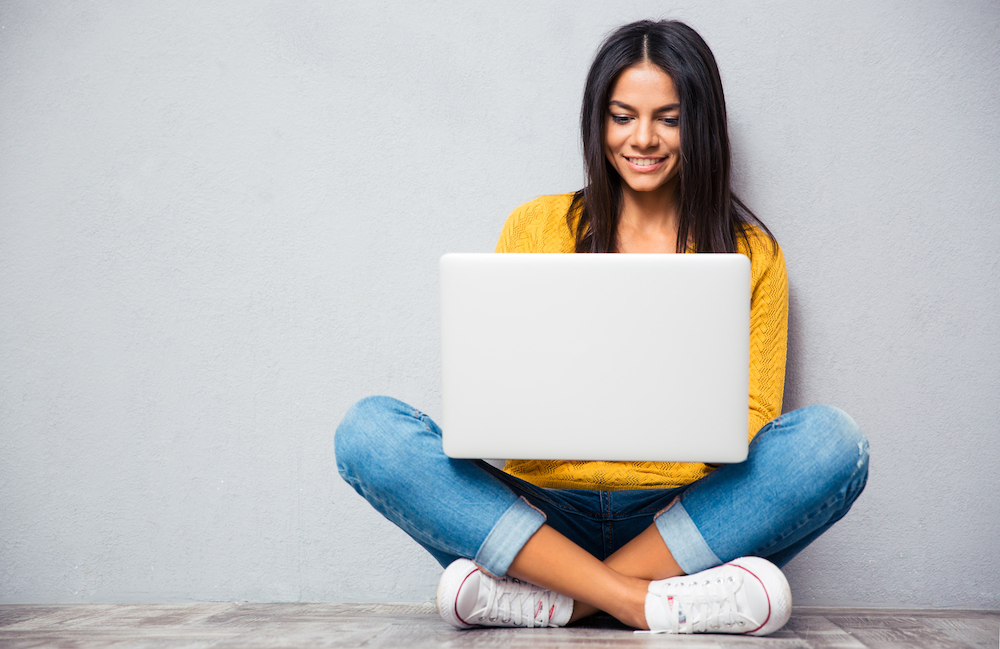 One of the best SEO specialists typing on her laptop while creating content for a client