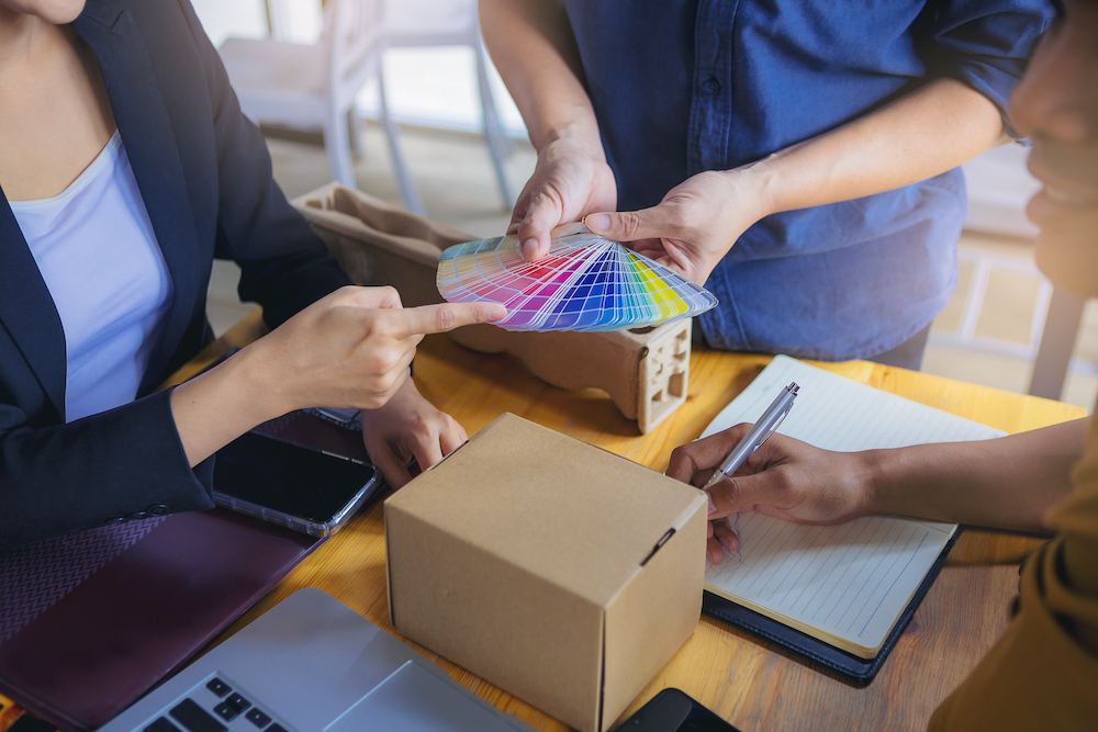 A group of designers working on creating custom printing solutions for a client