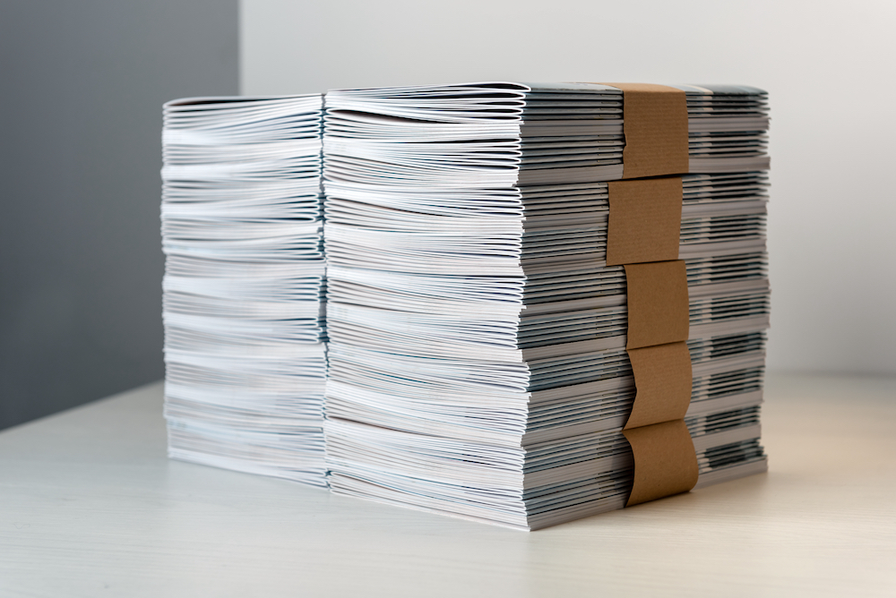 A stack of brochures as a part of custom printing services